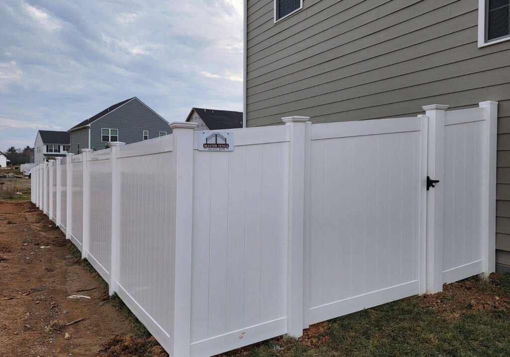 Custom white vinyl fence installed by Master Fence