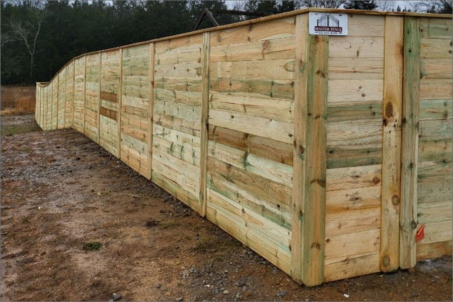 Wooden fence on a slope